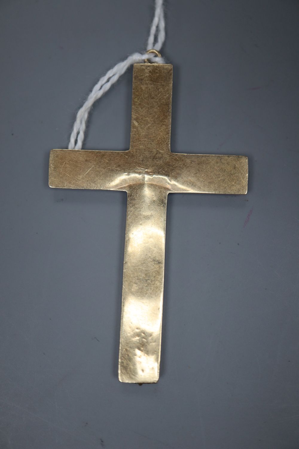 A Victorian yellow metal, black enamel and split pearl set mourning cross pendant, 57mm, gross 3.3 grams.
